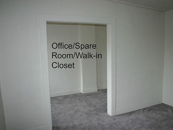 Spare room off of living room. Could be used as office or large walk in closet.