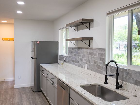 upgraded fixtures and quartz countertops