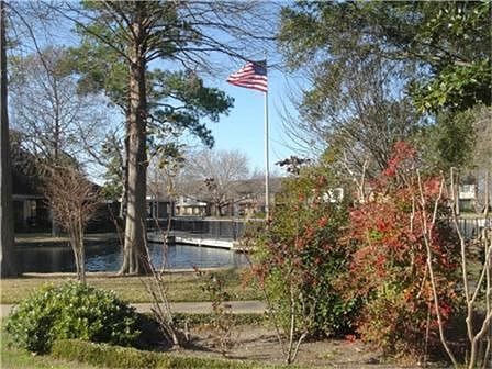 Welcome to the Forrest Lake T/H Community! This beautiful view is one of many you will see. There is ample green space and small lake.