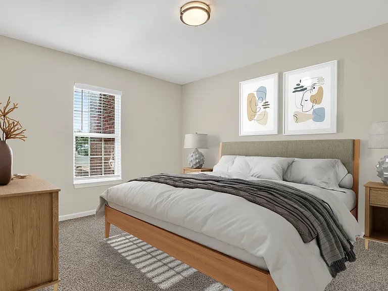 Bright and cozy bedroom featuring a plush bed with elegant linens, modern artwork, and a sunlit window creating a serene atmosphere.