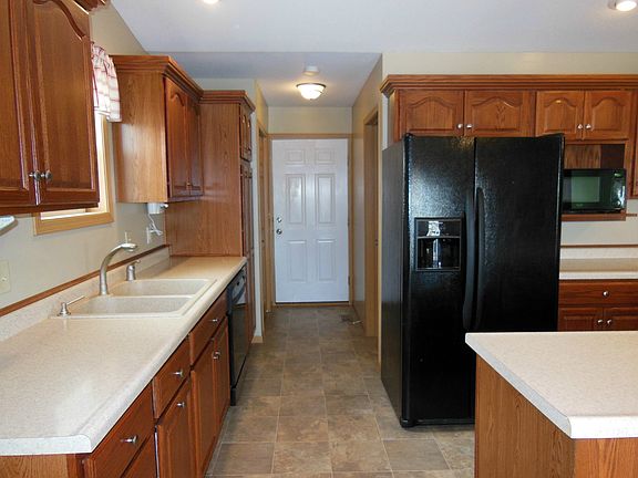 Kitchen w/ entry to garage