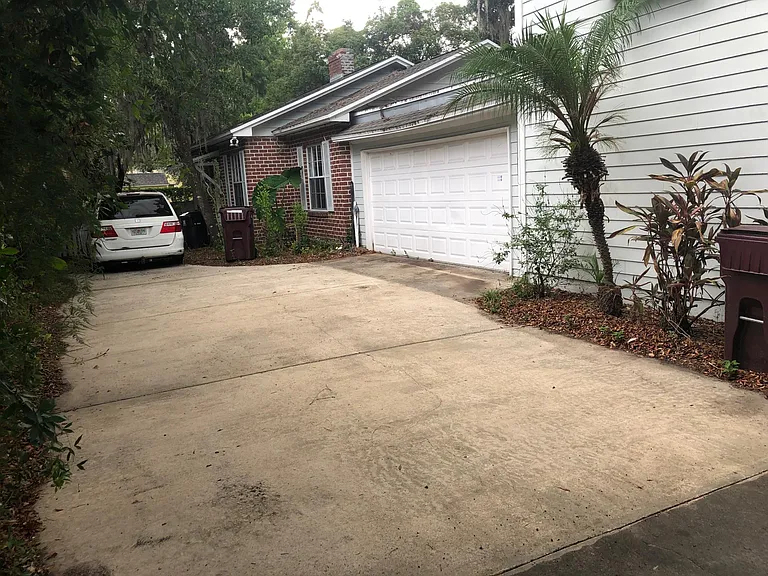 Drive Way with 2 car Garage Door.