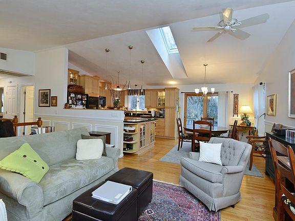 Open floor plan with vaulted ceiling
