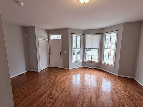 Additional view of living room and coat closet