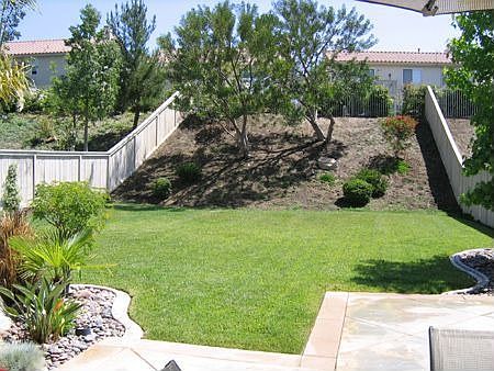 Picturesque Pool-Size Backyard. BeautifullyLandscaped Grounds