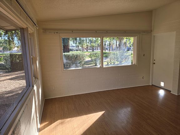 Living room with large view windows of the golf course