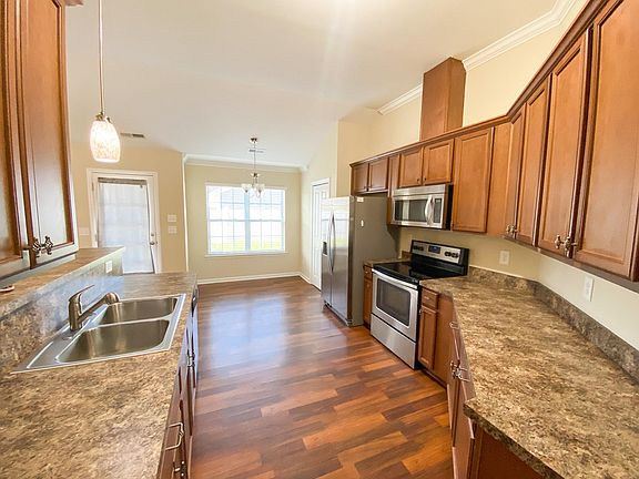Beautiful kitchen with stainless appliances, plenty of counter space, and abundant cabinets