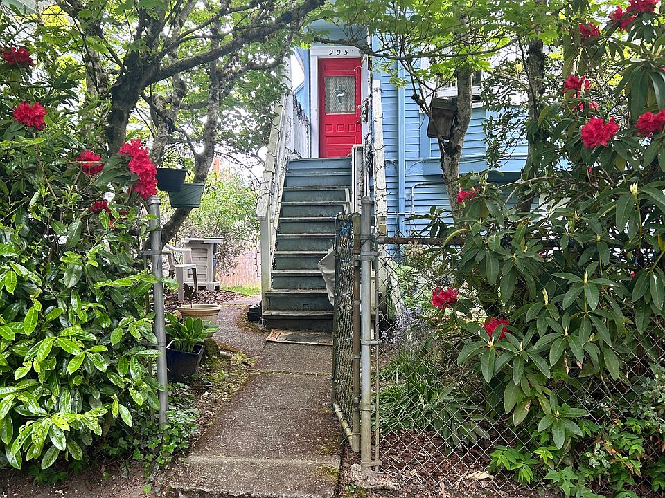 Front entrance to the property, unit is down the left side of the house to the second red door to the unit.