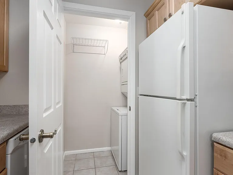 Laundry closet with washer and dryer.