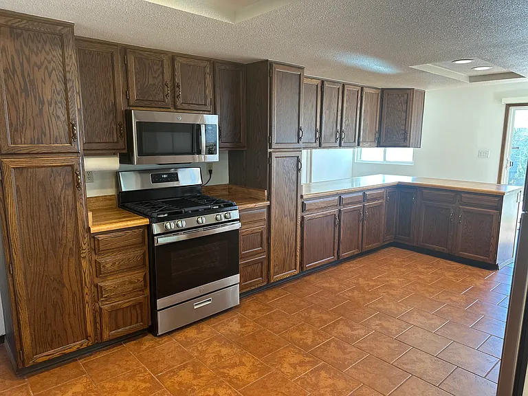 Lots of storage in the kitchen and brand new stainless steel appliances.
