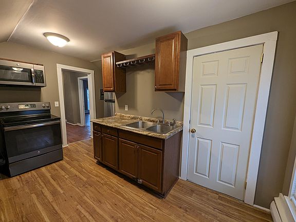 Kitchen view from window with door to bathroom