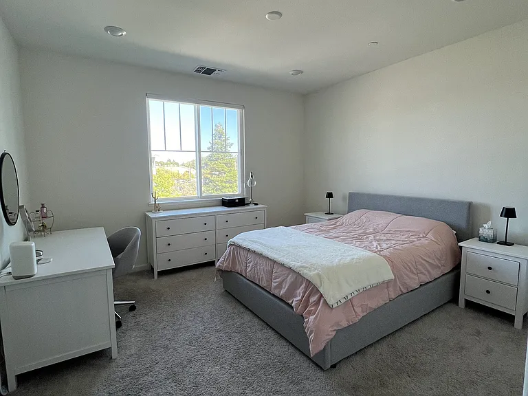 Primary Bedroom with Walk-in Closet & Ensuite Bathroom.