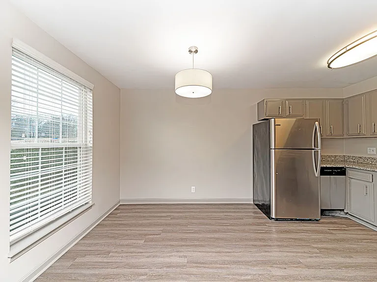 Dining area with hardwood-style flooring