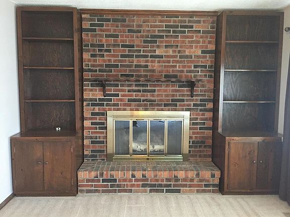 Woodburning Fireplace and built-ins on main level living room.