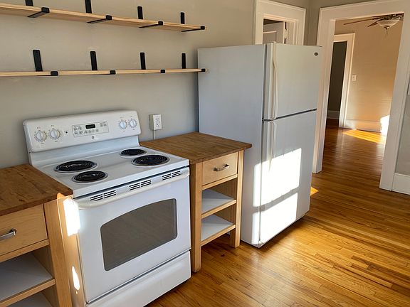 Other kitchen wall. Back porch to left; dining room visible on right