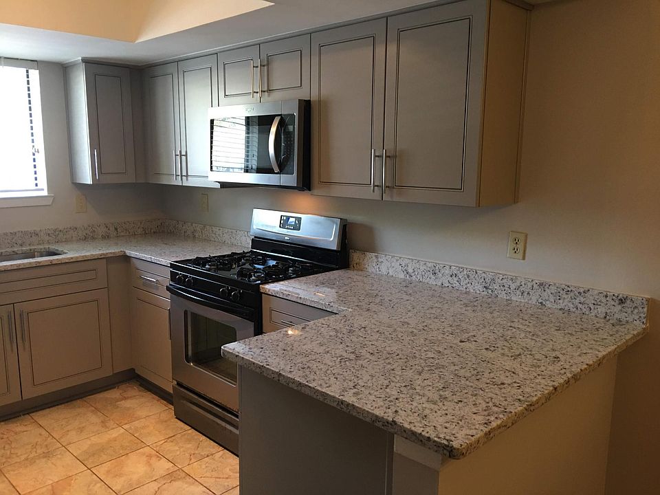 New Kitchen with Granite Countertops and stainless steel appliances.