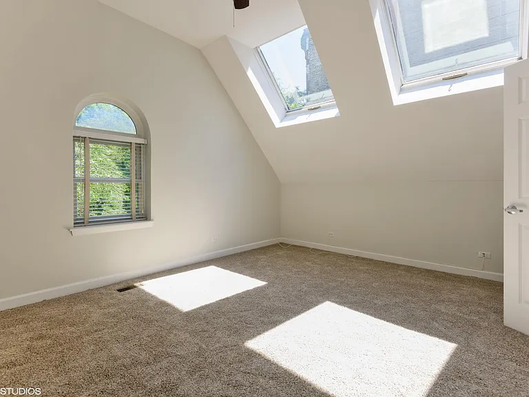 2nd floor bedroom with skylights