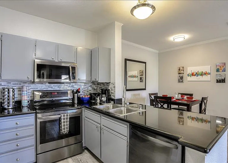 Kitchen with Granite Countertop and modern appliances