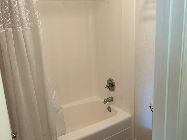 Shower tub just re-glazed.