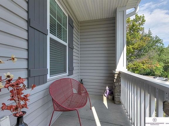 South facing.  Vinyl siding and a sprinkler system.