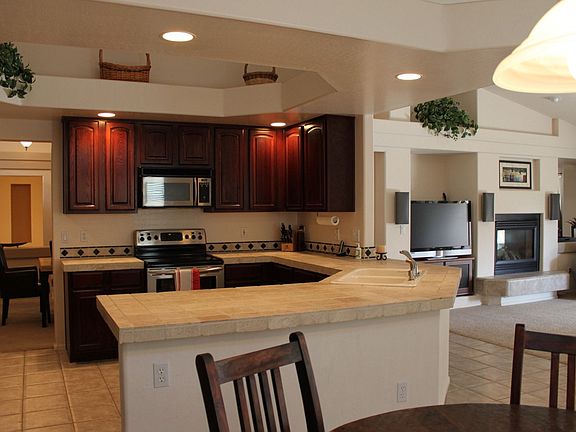 Open Kitchen with Cherry cabinets and SS appliances