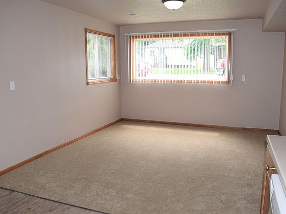 Brand new carpet and big windows in living room