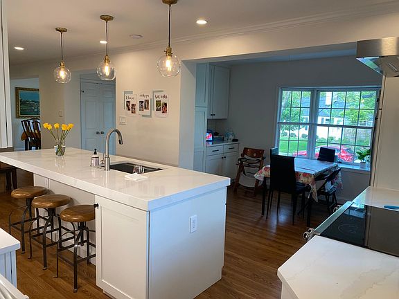 remodeled chef's kitchen with breakfast nook overlooking bay window