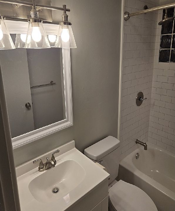 Remodeled Bathroom; Replaced everything from Top Down; Vanity, Light, Medicine Cabinet, Toilet, Tile Flooring, Tub, Faucets, Shower Curtain Rod, etc.