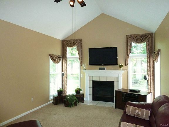 Great room-Cathedral ceiling, Gas fireplace- Custom mantle- Corner windows