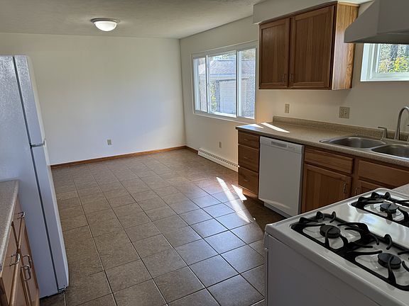 Kitchen looking to Large Dining Area w large backyard window