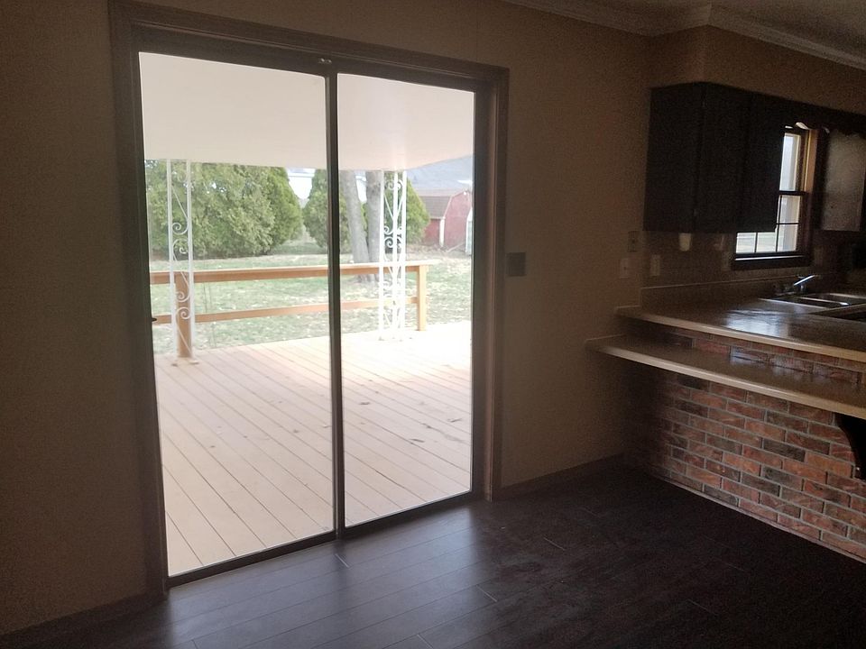 Kitchen with sliding doors onto large entertaining covered d