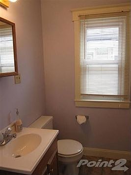 The bathroom is squeaky clean with a newer vanity that is great for storage and buyers will apprecia