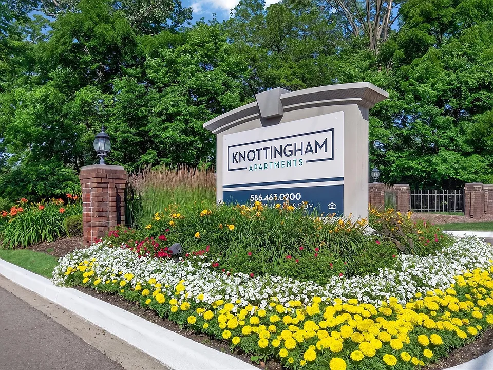 Welcoming entrance at Knottingham Apartments in Clinton Township, MI.