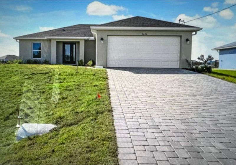 Front of House with paver driveway