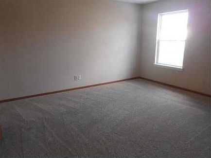 Master Bedroom Shown here. Wood blinds have been added