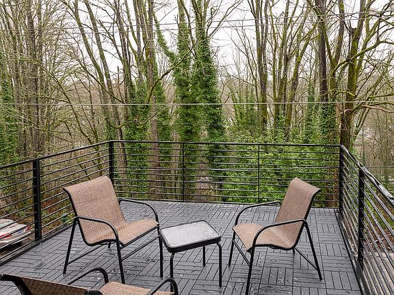 front patio with street view and woods across the street