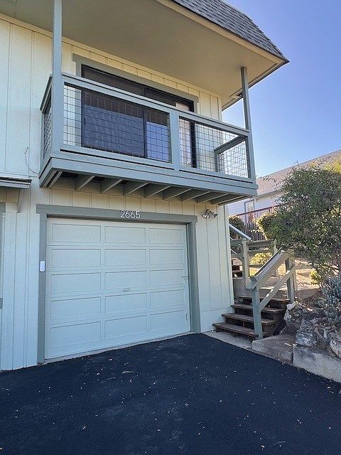 Stairs up to the right lead to front door