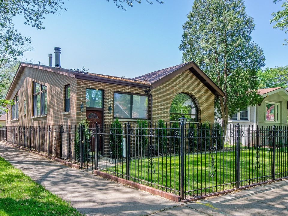 All brick home sitting on an oversized, corner-lot offers immediate curb appeal.