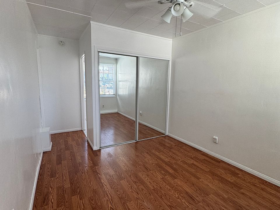 View of the entry room with large closet and ceiling fan.