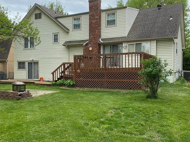 Large Fenced backyard with 2 decks and Fire pit area