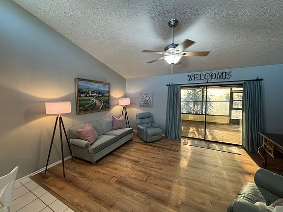 Vaulted ceilings in Family room with windows up above for extra natural light!