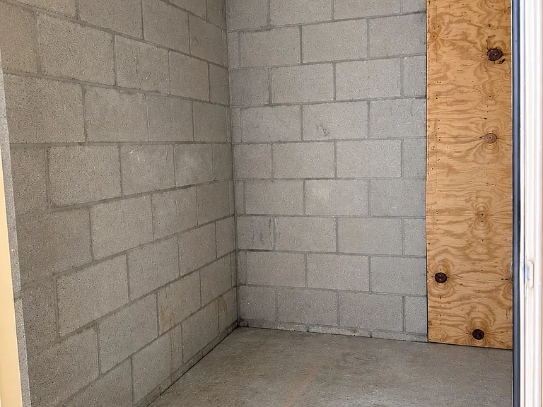 Private exterior storage room offering additional space for bikes, beach gear, and more