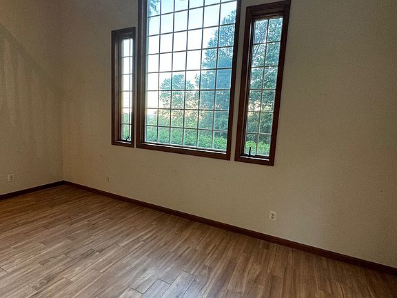 Great room with large windows and high ceilings