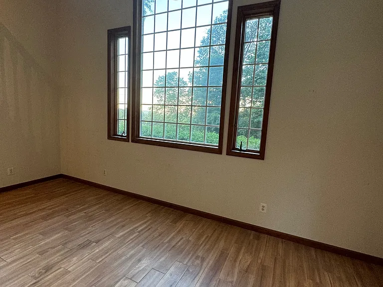 Great room with large windows and high ceilings