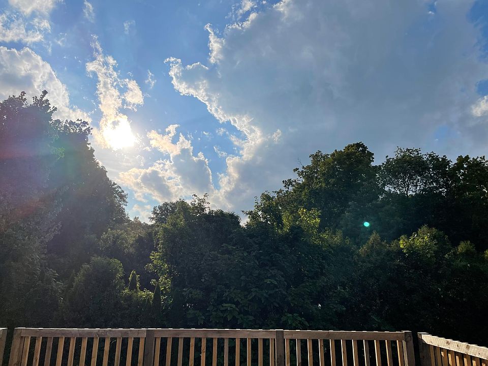 Peaceful, sun filled rooftop balcony awaits your outdoor rug and patio furniture!