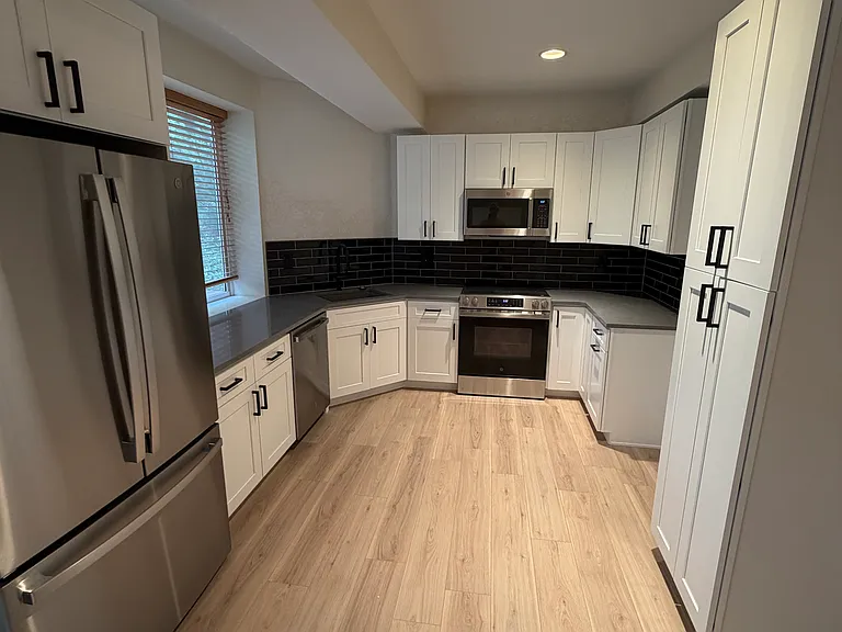 Brand new kitchen with full size GE appliances and dishwasher.