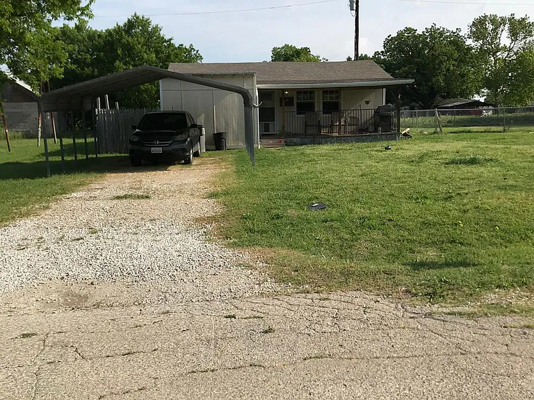 Front drive with carport. LAKEVIEW FROM YARD. LAKE ACCESS ACROSS STREET