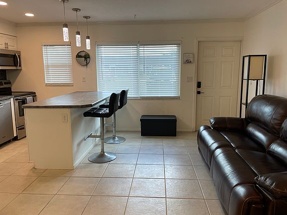 Entry Door + Open Living Area.