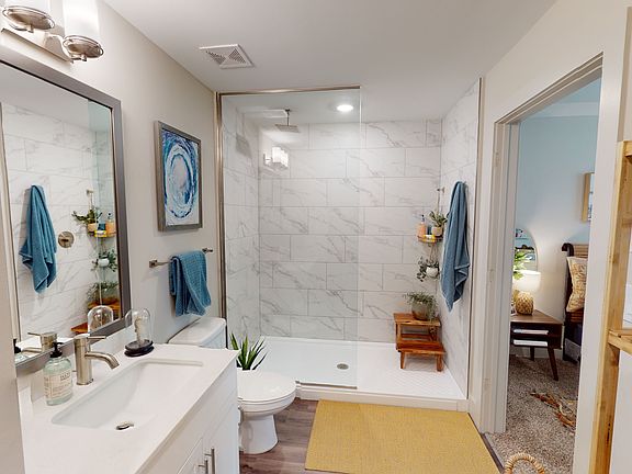 Walk-in shower with waterfall shower head