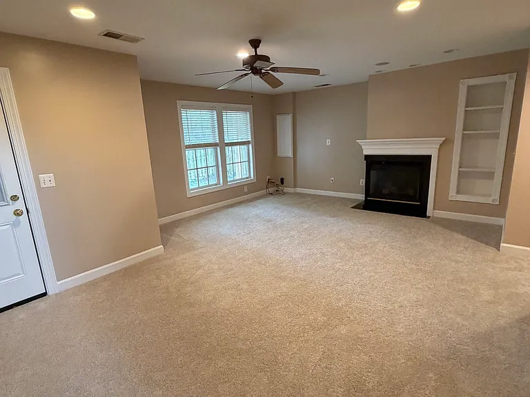 View toward fireplace and built-in shelves